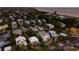 Aerial view of the home with mature trees, lush landscaping, and close proximity to the beach at 113 Maple Ave, Anna Maria, FL 34216