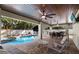 Spacious backyard with pool and covered dining area at 113 Maple Ave, Anna Maria, FL 34216