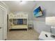 Cozy bedroom featuring a bunk bed, TV, and neutral decor, perfect for a relaxing stay at 113 Maple Ave, Anna Maria, FL 34216