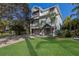 Charming two-story home with a well-manicured lawn and driveway at 113 Maple Ave, Anna Maria, FL 34216