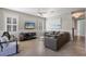 Cozy living room with a comfortable sofa, modern decor, and tile flooring throughout at 113 Maple Ave, Anna Maria, FL 34216