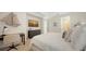 Bright bedroom with nautical-themed décor, desk, and dresser offers a comfortable, stylish retreat at 11847 Meadowgate Pl, Lakewood Ranch, FL 34211