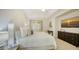 Bright bedroom features a ceiling fan, large window, and a comfortable neutral color scheme at 11847 Meadowgate Pl, Lakewood Ranch, FL 34211