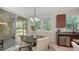 Cozy breakfast nook with views of the backyard through sliding glass doors at 11847 Meadowgate Pl, Lakewood Ranch, FL 34211