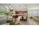 Bright kitchen with granite countertops, stainless appliances, and adjoining dining area at 11847 Meadowgate Pl, Lakewood Ranch, FL 34211
