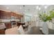 Modern kitchen connects to dining and living spaces, creating an open and inviting atmosphere at 11847 Meadowgate Pl, Lakewood Ranch, FL 34211