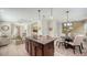 Open concept kitchen with island and dining area, perfect for modern living at 11847 Meadowgate Pl, Lakewood Ranch, FL 34211