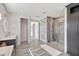 Spacious bathroom featuring a vanity and a large walk-in shower with decorative tile at 11913 Blue Hill Trl, Bradenton, FL 34211