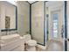 Elegant bathroom showcasing distinctive tile work, vessel sink, and glass-enclosed shower at 11913 Blue Hill Trl, Bradenton, FL 34211