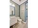 Modern bathroom featuring custom tile, stylish fixtures, and a glass door shower at 11913 Blue Hill Trl, Bradenton, FL 34211