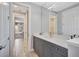 Modern bathroom with granite countertop, tile floors and is connected to a themed bedroom at 11913 Blue Hill Trl, Bradenton, FL 34211