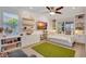 Comfortable bedroom featuring built-in shelving, a large window and a decorative rug at 11913 Blue Hill Trl, Bradenton, FL 34211