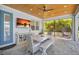 Relaxing covered patio with dining area and swing, perfect for enjoying outdoor meals and lounging at 11913 Blue Hill Trl, Bradenton, FL 34211