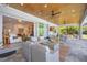Spacious covered patio with comfortable seating and open access to indoor living areas at 11913 Blue Hill Trl, Bradenton, FL 34211