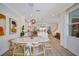 Open-concept dining area with modern lighting, seamlessly connected to the kitchen at 11913 Blue Hill Trl, Bradenton, FL 34211