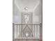 Elegant foyer with staircase featuring decorative railing and modern pendant lighting at 11913 Blue Hill Trl, Bradenton, FL 34211