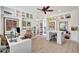Bright home office with custom built-in bookshelves and modern decor at 11913 Blue Hill Trl, Bradenton, FL 34211