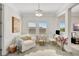 Bright office with a comfy white chair and view to the backyard at 11913 Blue Hill Trl, Bradenton, FL 34211