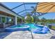 Relaxing screened-in pool area with a spa and water views at 11913 Blue Hill Trl, Bradenton, FL 34211