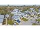 Stunning aerial view of the neighborhood featuring beautifully maintained homes, landscaping, and private driveways at 1223 Siesta Bayside Dr # 1223, Sarasota, FL 34242