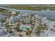 Beautiful aerial view of the waterfront community with a swimming pool and lush tropical landscaping at 1223 Siesta Bayside Dr # 1223, Sarasota, FL 34242