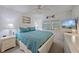 Cozy bedroom with a blue comforter, soft lighting, and a calming coastal aesthetic at 1223 Siesta Bayside Dr # 1223, Sarasota, FL 34242