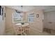 Cozy dining area with bright windows and a decorative light fixture, perfect for intimate meals at 1223 Siesta Bayside Dr # 1223, Sarasota, FL 34242