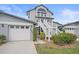 Charming two-story townhouse with well-maintained landscaping and a private one-car garage at 1223 Siesta Bayside Dr # 1223, Sarasota, FL 34242