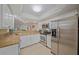 Well-equipped kitchen showcasing stainless steel appliances, granite countertops, and ample cabinet space at 1223 Siesta Bayside Dr # 1223, Sarasota, FL 34242