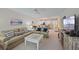 Inviting living room with beach-themed decor and plush seating, perfect for relaxation at 1223 Siesta Bayside Dr # 1223, Sarasota, FL 34242