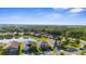 Residential community with homes surrounding a pond, showcasing a serene neighborhood at 12565 Ryegrass Loop, Parrish, FL 34219