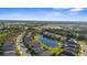 Overhead view showcasing a community built around a lake at 12565 Ryegrass Loop, Parrish, FL 34219