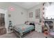 Inviting bedroom featuring a comfortable bed, playful decor, and plenty of natural light at 12565 Ryegrass Loop, Parrish, FL 34219