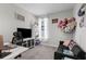 Bright bedroom featuring a desk, sofa, a window with natural light, and light gray walls at 12565 Ryegrass Loop, Parrish, FL 34219