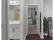 Hallway leading to a bathroom on one side and a bedroom on the other side at 12565 Ryegrass Loop, Parrish, FL 34219