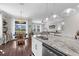 Updated kitchen featuring a large island with seating and stainless steel dishwasher at 12565 Ryegrass Loop, Parrish, FL 34219