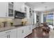 Charming kitchen flows seamlessly to dining area, offering great views at 12565 Ryegrass Loop, Parrish, FL 34219