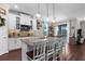 Well-appointed kitchen with a spacious island, pendant lighting, and views to the outdoor space at 12565 Ryegrass Loop, Parrish, FL 34219