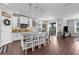 Spacious kitchen with a large island, stylish pendant lights, and seamless flow to dining area at 12565 Ryegrass Loop, Parrish, FL 34219