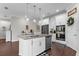 Modern kitchen boasts an island with a sink, and stainless steel appliances at 12565 Ryegrass Loop, Parrish, FL 34219