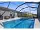 Inviting screened-in pool with poolside seating and grilling area, great for entertaining guests at 12565 Ryegrass Loop, Parrish, FL 34219