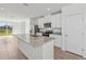 Modern kitchen featuring stainless steel appliances, granite countertops and an island with a sink at 14061 Crutchfield Ct, Parrish, FL 34219