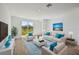 Bright living room with neutral furniture, a blue rug, and sliding glass doors to the backyard at 14061 Crutchfield Ct, Parrish, FL 34219