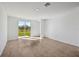 Open floor plan featuring a tile floor and sliding glass doors to the backyard at 14061 Crutchfield Ct, Parrish, FL 34219