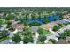 Aerial view of a property showcasing its location near a lake and neighborhood at 14230 Cattle Egret Pl, Lakewood Ranch, FL 34202