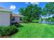 Lush backyard with well-maintained lawn and landscaping, offering tranquil views of the pond and a peaceful retreat at 14230 Cattle Egret Pl, Lakewood Ranch, FL 34202