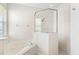 Bright bathroom featuring tub, glass shower, and white tile at 14230 Cattle Egret Pl, Lakewood Ranch, FL 34202