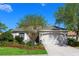Charming single-story home with a two-car garage and well-manicured landscaping at 14230 Cattle Egret Pl, Lakewood Ranch, FL 34202