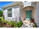 Inviting front entrance with manicured landscaping, a charming porch, and a freshly painted exterior, radiating curb appeal at 14230 Cattle Egret Pl, Lakewood Ranch, FL 34202
