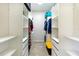 Walk-in closet with custom shelving and ample storage space at 14230 Cattle Egret Pl, Lakewood Ranch, FL 34202